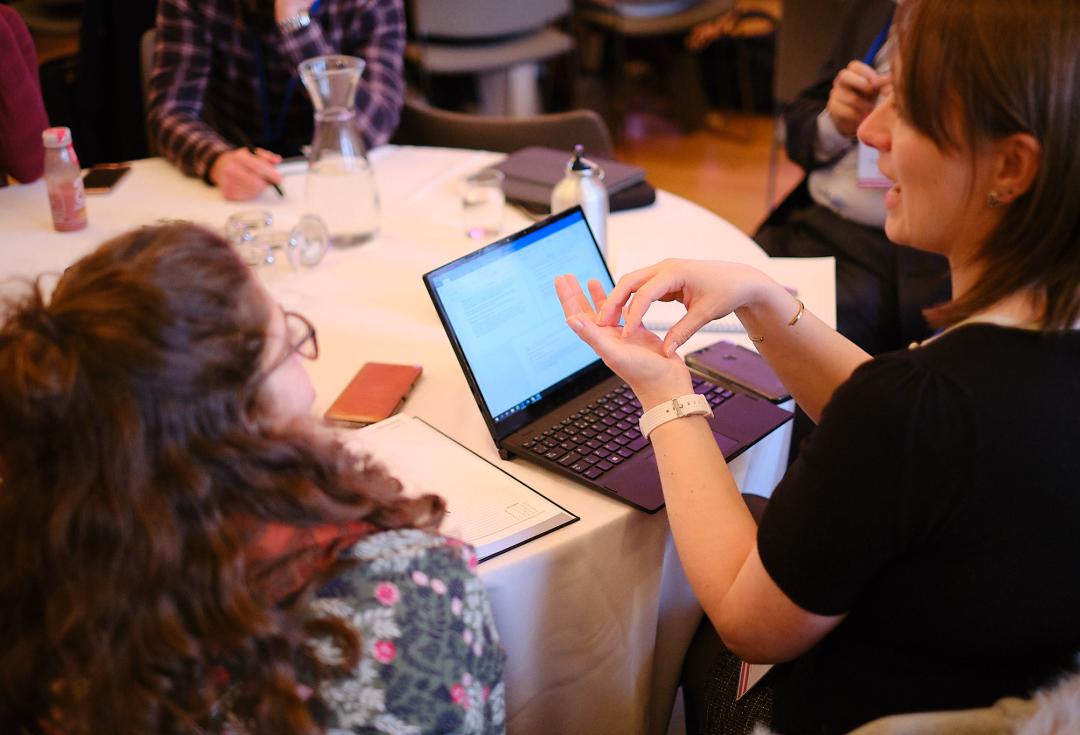 Discussion around laptop during training